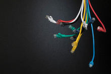 Contrasting Multicolor Computer Cables Dangling In Bundle