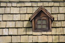 Old Window On The Roof Of Cedar Shingles