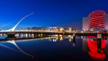 Blue Hour At Dublin Docks, Samuel Beckett Bridge And Convention Centre. Illuminated Embankment And Blurred Water. Long Exposure Photography, Ireland