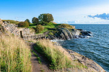 Wall Mural - Helsinki. Finland. Ancient fortress on the Baltic sea. Rocky coast of the sea. The Fortress Of Suomenlinna. Stone walls of the fortress Sveaborg. Travelling to Helsinki. Sights Of Helsinki.