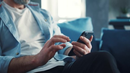 close up view of male hands uses phone texting message, browsing surfinf internet tapping scrolling 