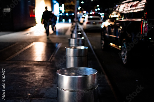 Fotografía Close-Up of Stainless Steel Bollard at Night