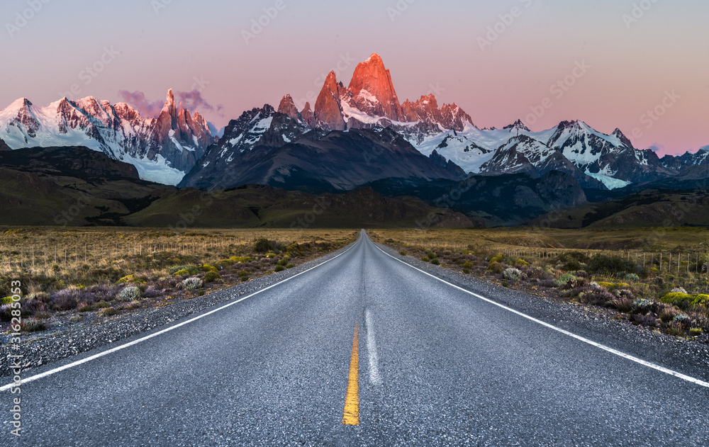 Beautiful Alpine Glow / first light on Mount Fitz Roy viewed from Road to El Chalten - obrazy, fototapety, plakaty 