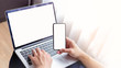 © panitan - mockup image blank screen computer,cell phone with white background for advertising text,hand man using laptop texting mobile contact business search information on desk in cafe.marketing,design
