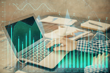  Double exposure of forex chart with man working on computer on background. Concept of market analysis.