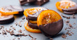 Candied orange slices in chocolate. Slate background. Close up.