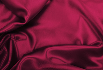 Smooth elegant pink silk or satin luxury cloth texture as abstract background. Luxurious valentines day background design