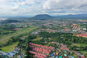 Aerial view of the wild river with the old wooden bridge connecting between two mainland in Kampung Imbak, Tongod, Sabah, Malaysia, Borneo.