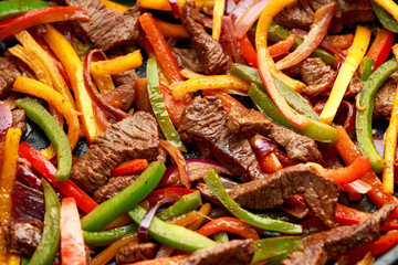 Poster - Beef Steak Fajitas with mix pepper, onion and avocado on wooden board