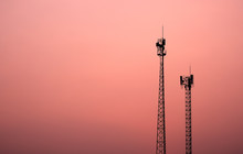 Antenna Broadcast Signal Telecommunication In An Pink Orange Sky Background
