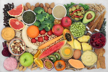 Wall Mural - Super food food for energy, fitness and vitality with fish, fruit, vegetables, nuts & herbs used in chinese herbal medicine. High in vitamins, minerals, antioxidants, smart carbs, protein & omega 3.