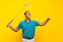 Afro American Golfer Player Man Over Isolated Yellow Background