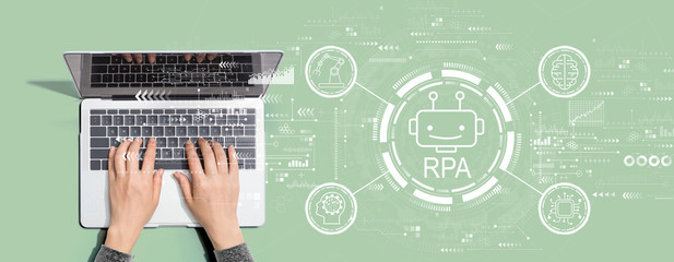 Robotic process automation concept with person using a laptop computer