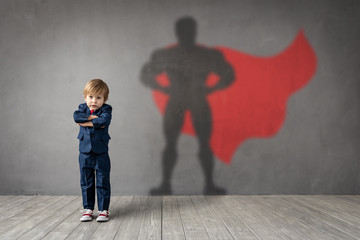 Wall Mural - Child dreams of becoming a superhero