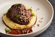 © Gecko Studio - Stewed veal cheeks with mashed potatoes on a white plate, close-up.