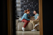 © Yakobchuk Olena - Merry couple chatting in living room stock photo