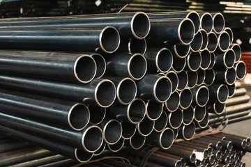 high quality Galvanized steel pipe or Aluminum and chrome stainless pipes in stack waiting for shipment  in warehouse