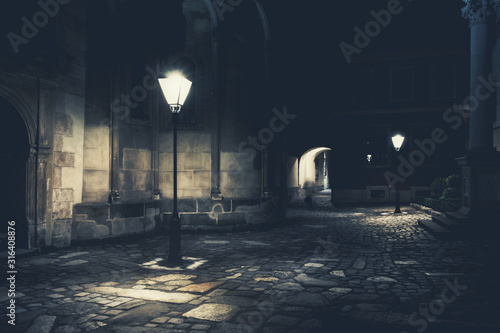 Fotomural illuminated street at night. Old european city
