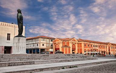 Wall Mural - Lugo, Ravenna, Emilia Romagna, Italy: view at dawn of the ancient square with the statue of the Italian top fighter ace of World War I Francesco Baracca