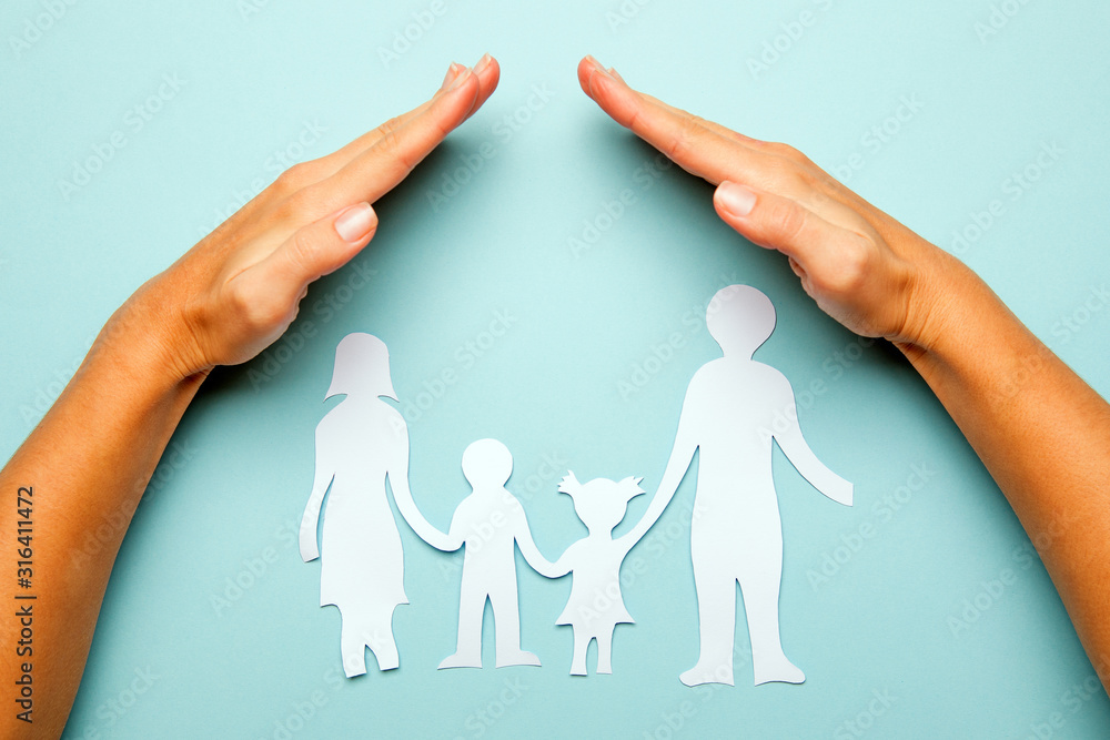 Paper family in hand isolated on blue background Stock Photo | Adobe Stock