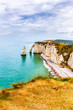 Panorama of natural chalk cliffs of Etretat with visible arche and beach coastline, Normandy, France, Europe