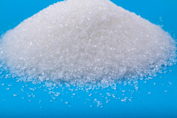  white granulated sugar on an blue background