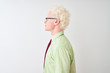© Krakenimages.com - Young albino businessman wearing shirt and tie standing over isolated white background looking to side, relax profile pose with natural face with confident smile.