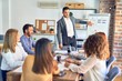 © Krakenimages.com - Group of business workers working together in a meeting. One of them making presentation to colleagues at the office