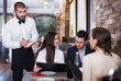 © JackF - Employee waiter man taking order from guests