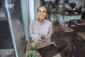 Wall Mural - Young cheerful lady outdoors and indoors