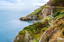 Train Exiting A Tunnel. View From Cliff Walk Bray To Greystones With Beautiful Coastline, Cliffs And Sea, Ireland
