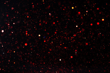 Poster - Beautiful bokeh on an abstract black background.