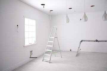 Canvas Print - Empty room with stretch ceiling and ladders