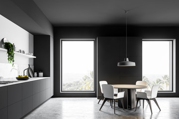 Gray kitchen interior with cupboard and table