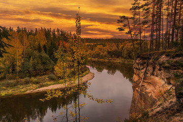 sunset on a river in autumn in latvia