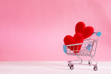 The Red Heart Shapes  In Shopping Cart On Sweet Pink Background , The Love Concept For Shopping On Valentines Day With Sweet And Romantic Moment