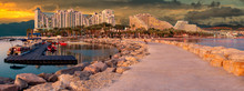 Morning Panoramic View From Public Walking Pier On Central Beach And Promenade Of Eilat - Famous Tourist Resort And Recreational City In Israel