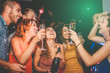 © Alessandro Biascioli - Happy friends doing party drinking champagne in nightclub - Group young people having fun celebrating new year eve holidays together in disco club - Youth culture entertainment lifestyle concept