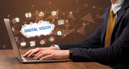 businessman working on laptop with digital vision inscription, modern technology concept