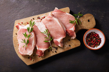 Poster - fresh pork chops with rosemary and spices, top view