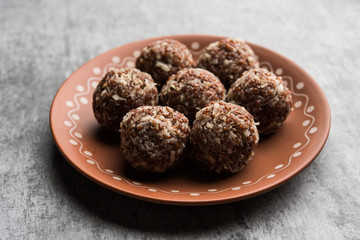 Aliv Laddu, Halim Ladoo or Garden cress Seed sweet Balls a very nutritious food in winters or for New Moms. popular food from India. served in a bowl or plate