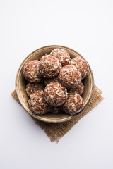 Canvas Print - Aliv Laddu, Halim Ladoo or Garden cress Seed sweet Balls a very nutritious food in winters or for New Moms. popular food from India. served in a bowl or plate