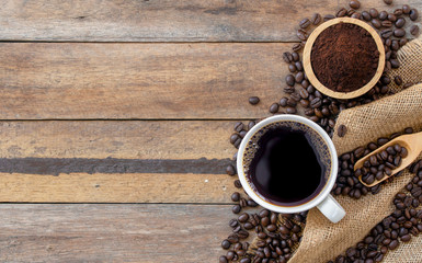 hot coffee and bean on wooden background. top view