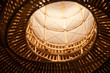 weaving bamboo lantern. handmade hanging lamp background and texture in night time. asian traditional Straw woven lantern.