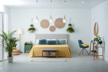 stylish room interior with large comfortable bed