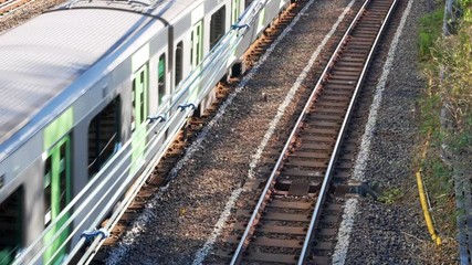 Canvas Print - POV from above railway while train is running pass surrounding with local landscape in suburban of Tokyo,Japan. Tokyo,Big CITY metropilitant transportation.