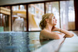 © BGStock72 - Young woman relaxing in spa swimming pool