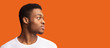 © Prostock-studio - Side portrait of masculine afro guy looking at copyspace