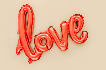 Wall Mural - Red Foil Balloons in the shape of the word 