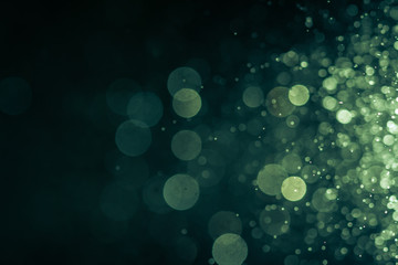 Abstract Green bokeh defocus glitter blur Background.